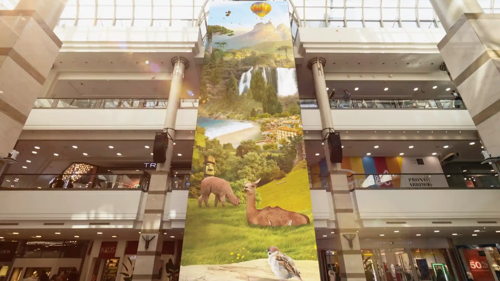 Immersive LED installation in the central square of Alto Las Condes, surrounding visitors with large-scale visual content.