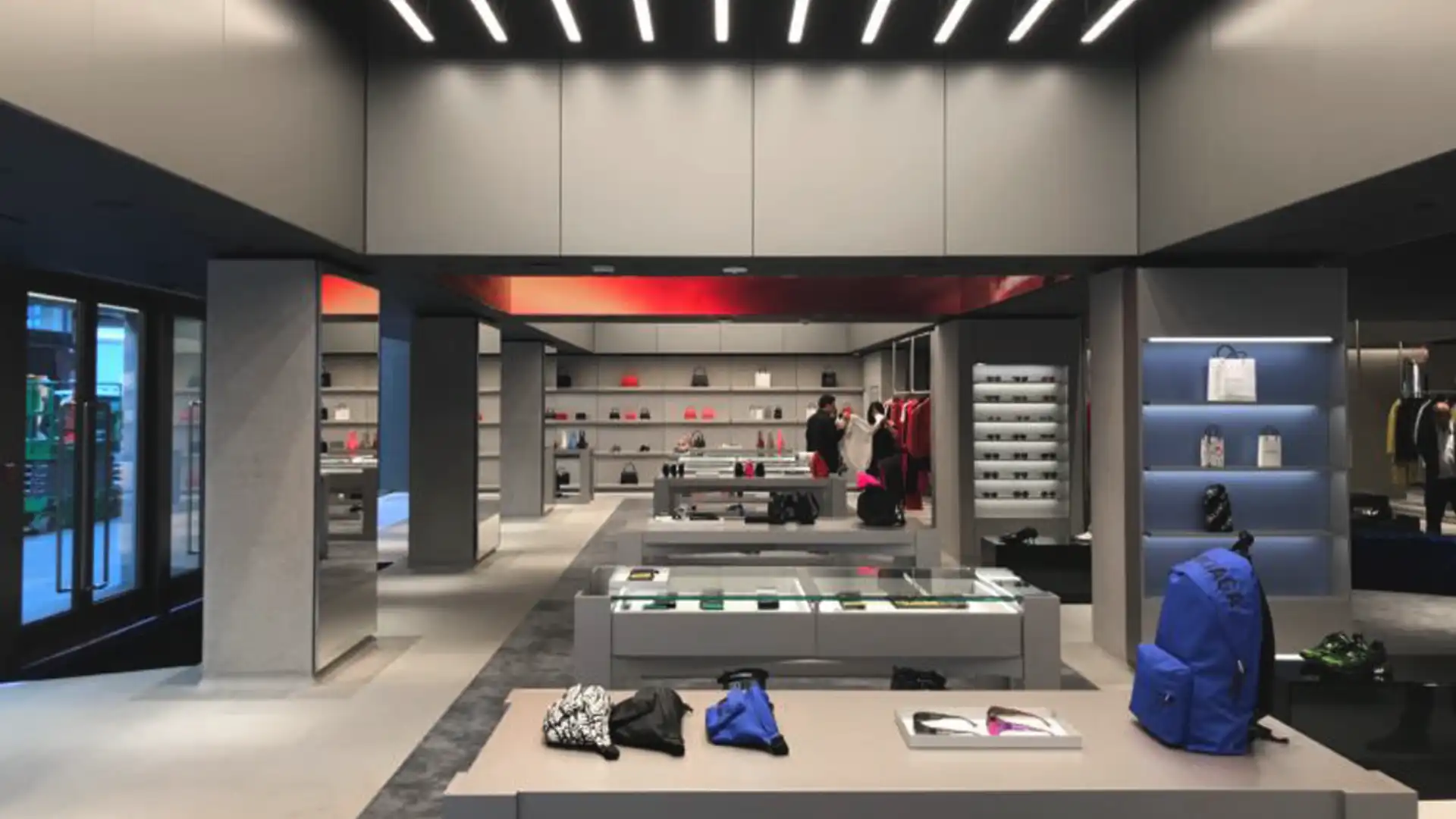 Customers interacting within Balenciaga’s immersive digital environment featuring LED surfaces and refined architecture.