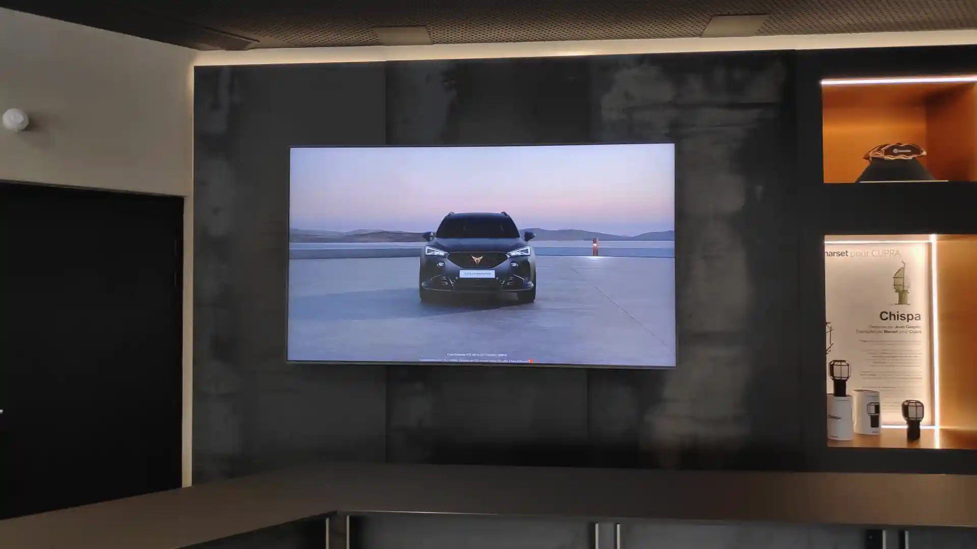 Digital storytelling screens inside CUPRA City Garage Paris communicating brand identity
