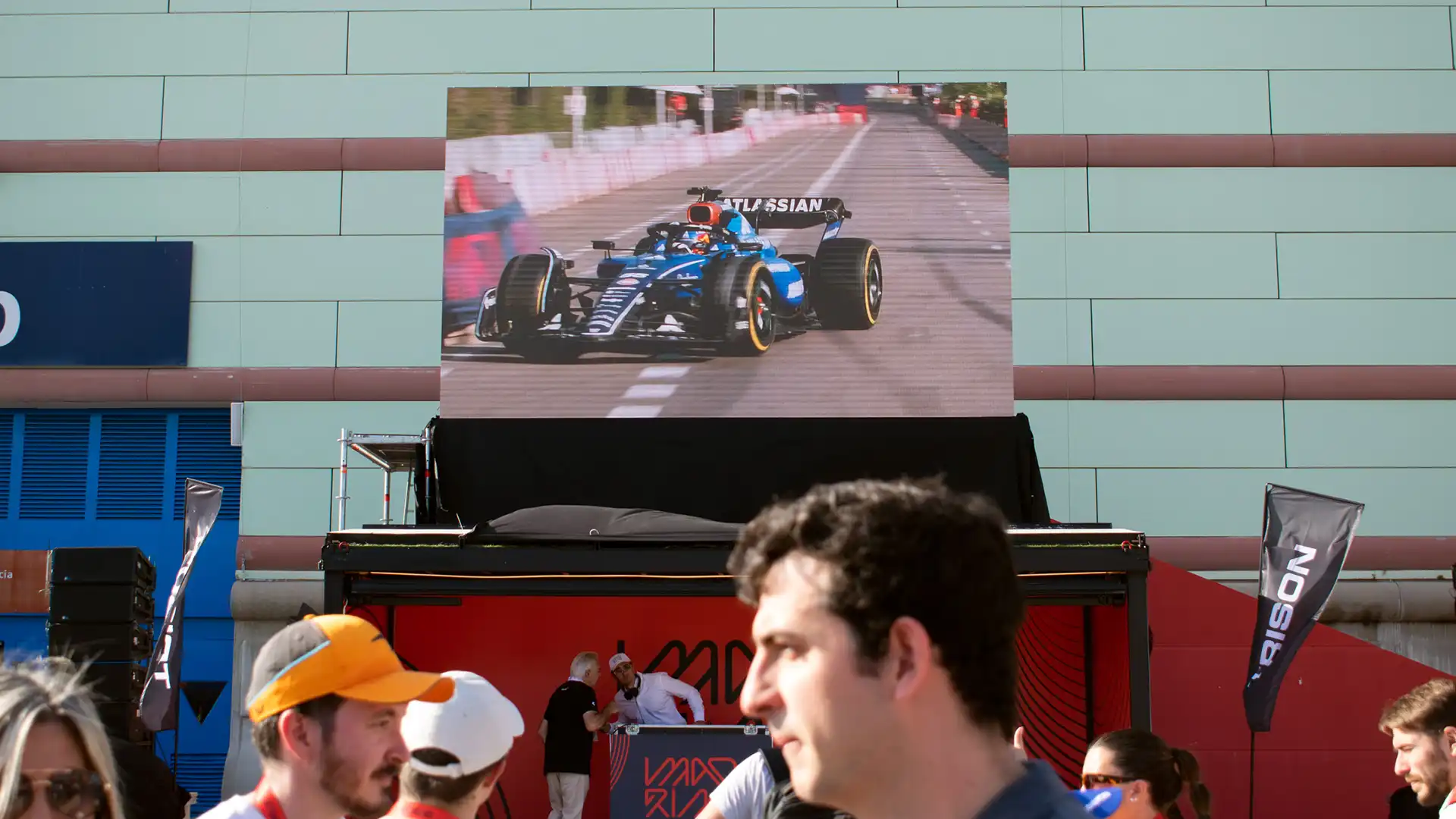 Large-format LED screens displaying F1 visuals during the Madrid roadshow.
