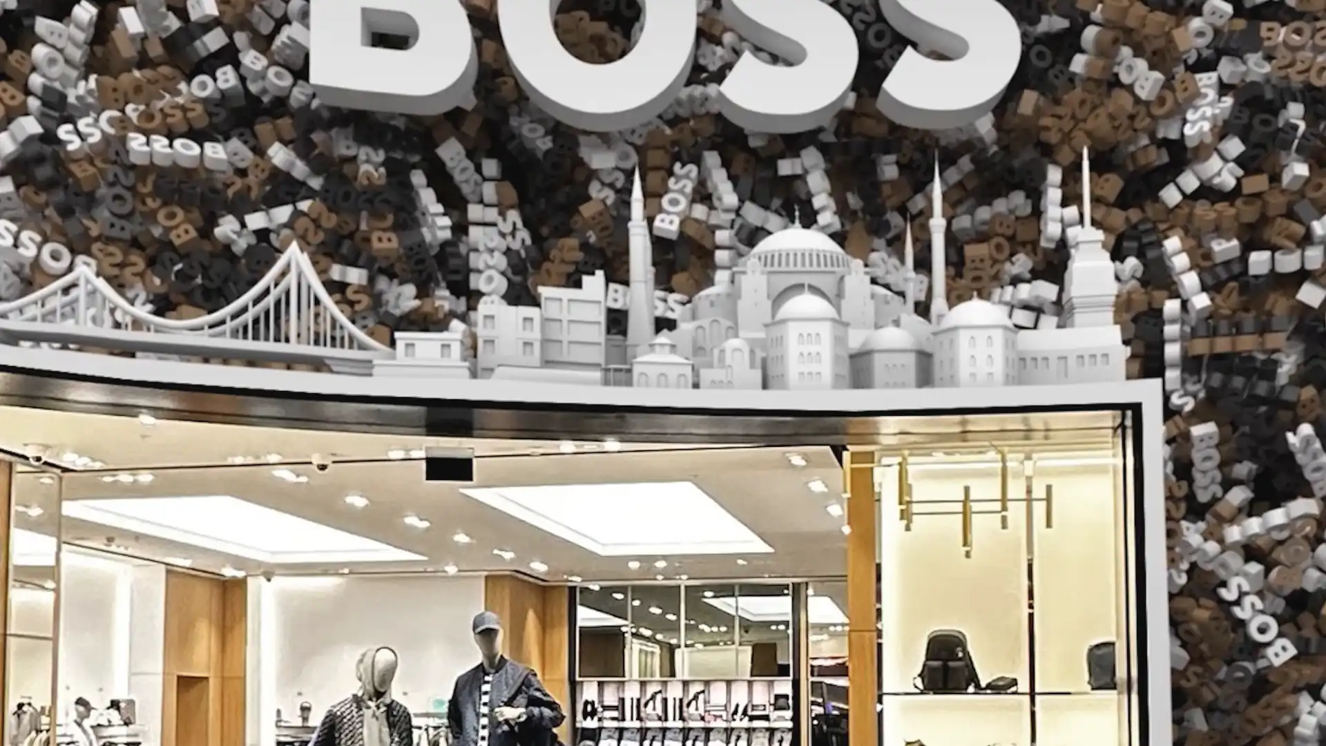 LED façade aligned with the Boss logo, creating a seamless premium digital environment.