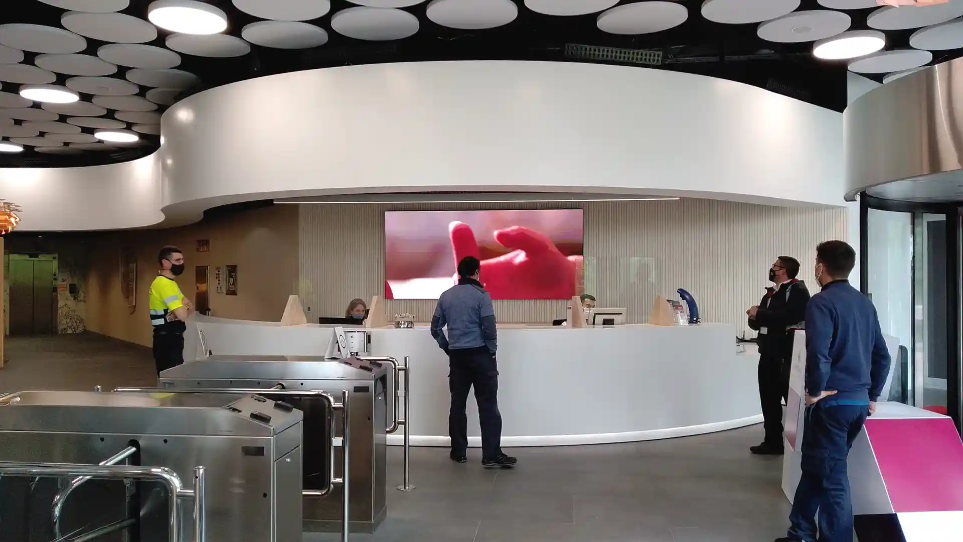 Digital signage displays inside the branch offering real-time updates and customer guidance