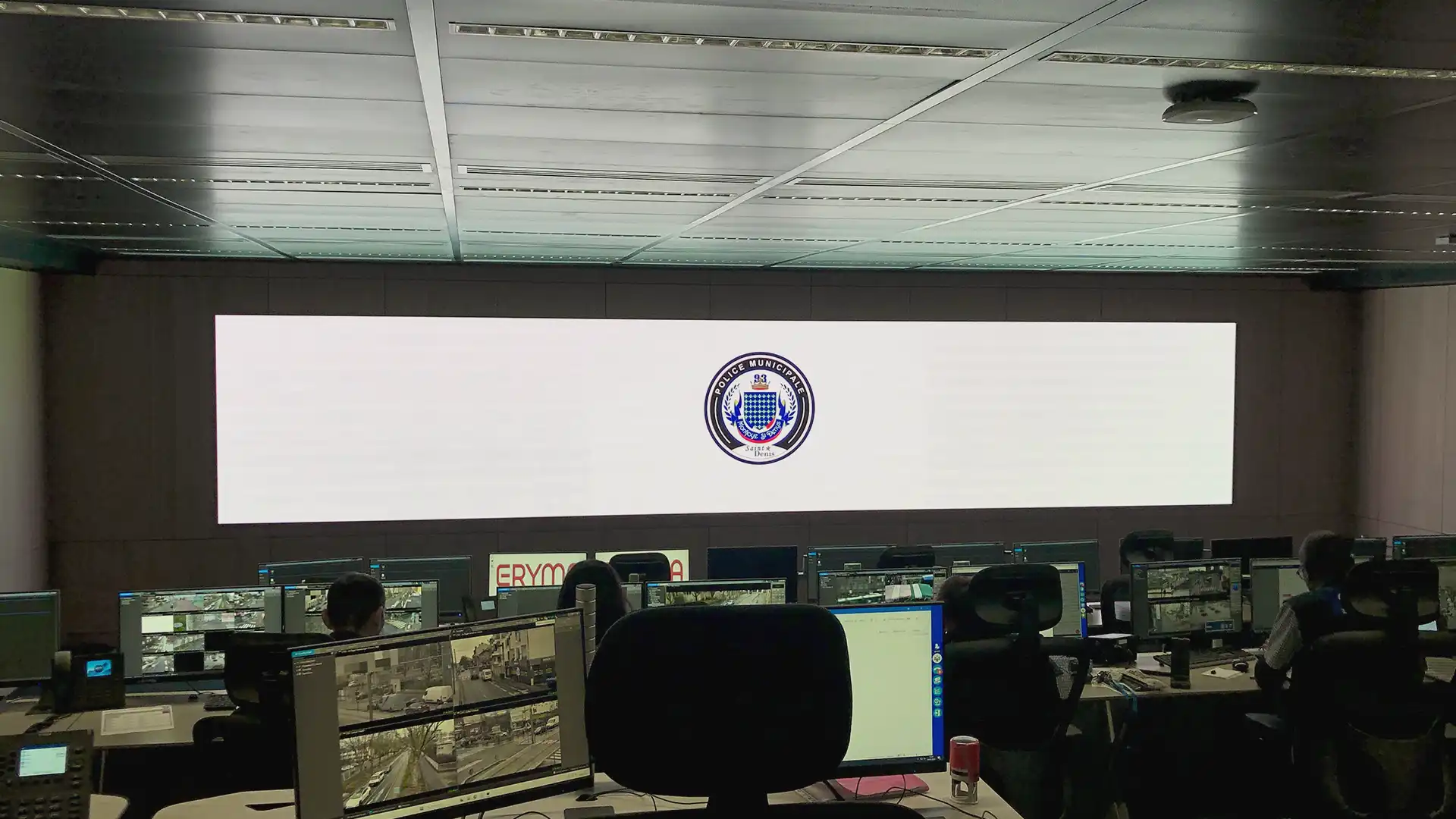 Wide view of Saint-Denis police control room featuring LED displays and audiovisual systems integrated by TRISON for Paris 2024.
