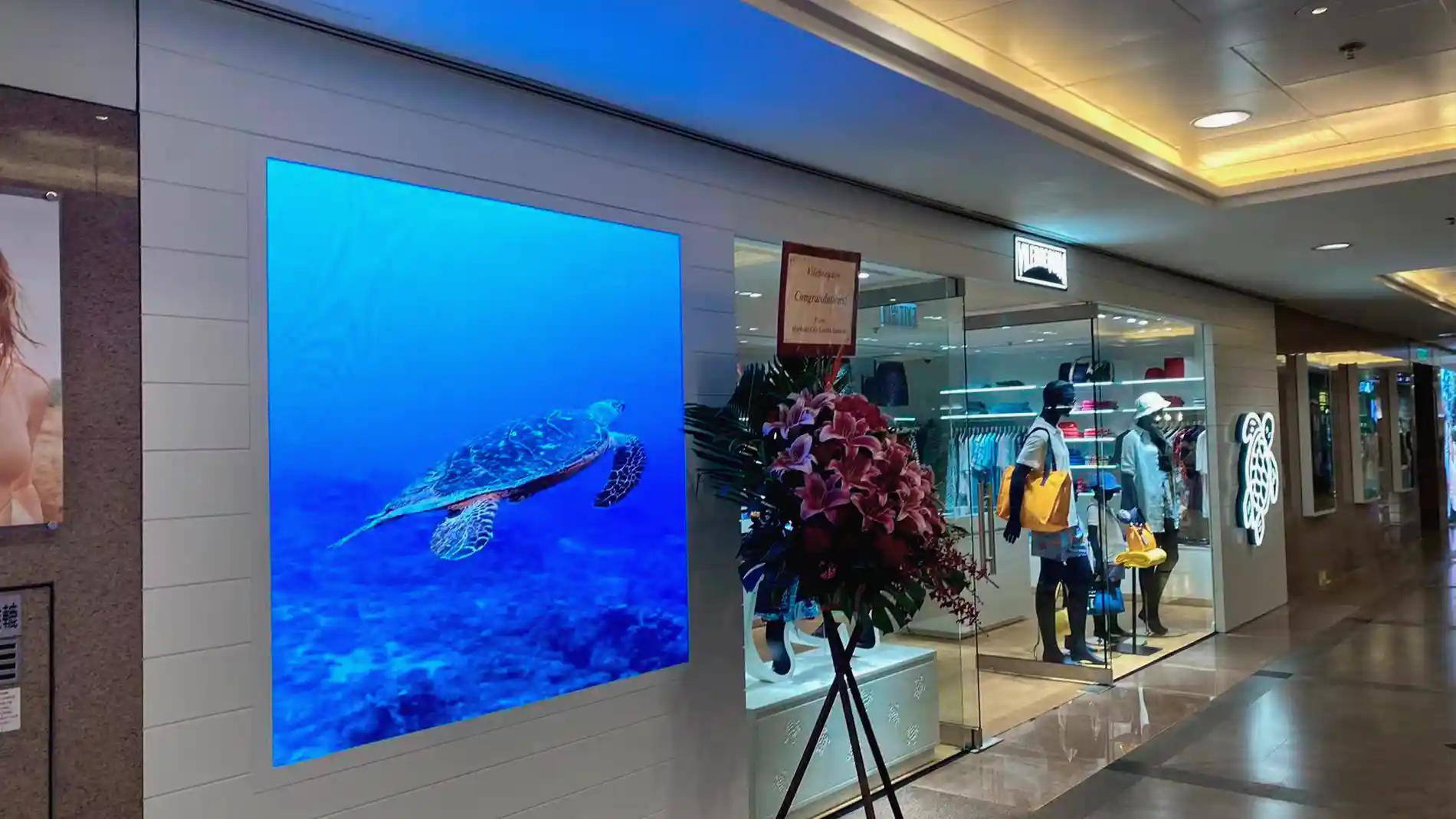 Permanent digital signage installation integrated into Vilebrequin’s retail environment in Hong Kong.